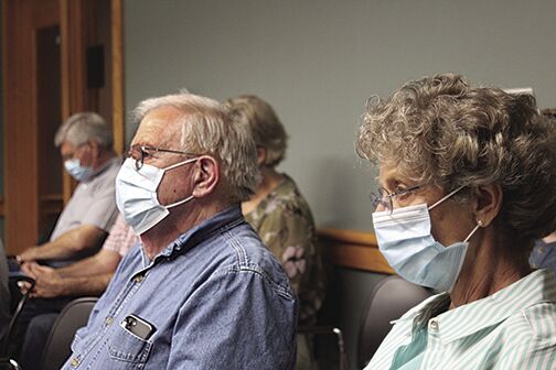 Residents wear masks after order